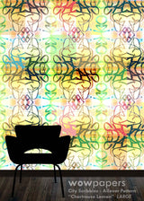 A colorful allover patterned wallpaper or wall mural shown in a room mockup, featuring a black chair silhouette at the bottom and a wood floor. The pattern contains overlapping script and floral-like motifs in yellow, green, blue, pink, and orange on a light background.