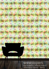 A repeating multicolor patterned wallpaper or fabric sample shown against a wall, with a black chair silhouette at the bottom left and a dark floor strip at the bottom. Text at the bottom reads 'wowpapers City Scribbles : Allover Pattern "Chartreuse Lemon" SMALL'.