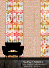 A wallpaper sample display featuring vertical stripes with a dense floral pattern in rose gold, pink, yellow, and white, with a black chair silhouette in the foreground and a 'wowpapers' watermark at the bottom.