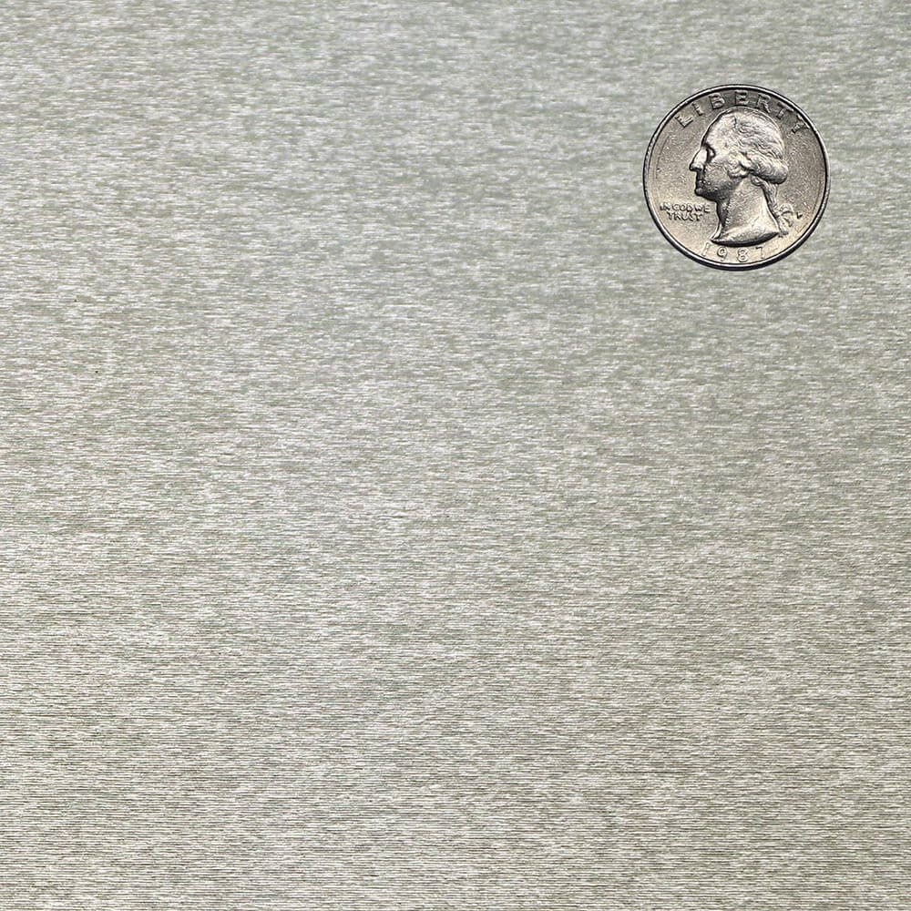 Silver quarter coin on a textured gray background