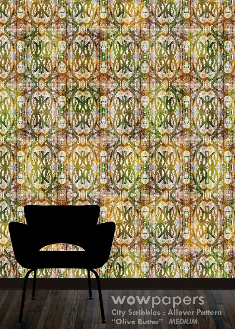 A repeating wallpaper pattern in olive green, yellow, beige, and brown tones, shown behind a black chair silhouette on a dark wood floor. Text at the bottom reads 'wowpapers City Scribbles : Allover Pattern "Olive Butter" MEDIUM'.