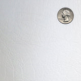 Silver quarter coin on a textured white background